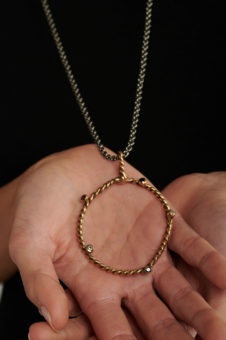 Pendente DNA bronzo e zirconi