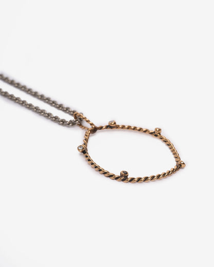Pendente DNA bronzo e zirconi