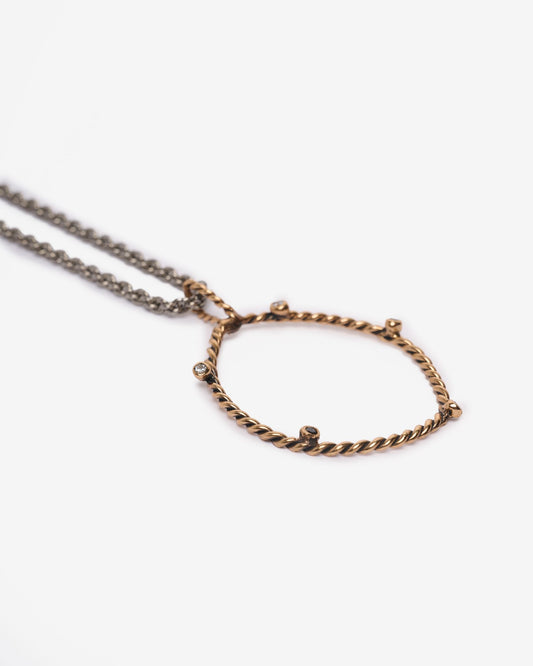 Pendente DNA bronzo e zirconi